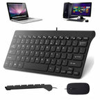 Black keyboard with mouse and laptop on a white background