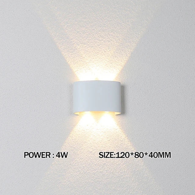 White wall-mounted light fixture on a gray wall with power and size information displayed.