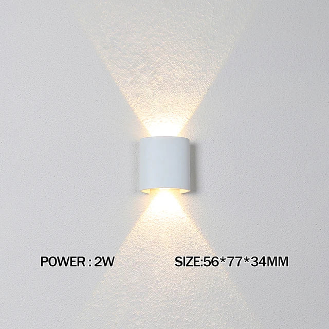 White wall-mounted light fixture on a gray background with power and size information displayed.