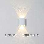 White wall-mounted light fixture on a gray background with power and size information displayed.