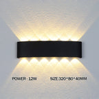 Black wall-mounted LED light fixture on a textured wall with power and size information displayed.