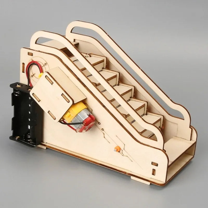 Wooden model of an escalator with electronic components on a gray background