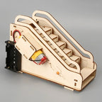 Wooden model of an escalator with electronic components on a gray background