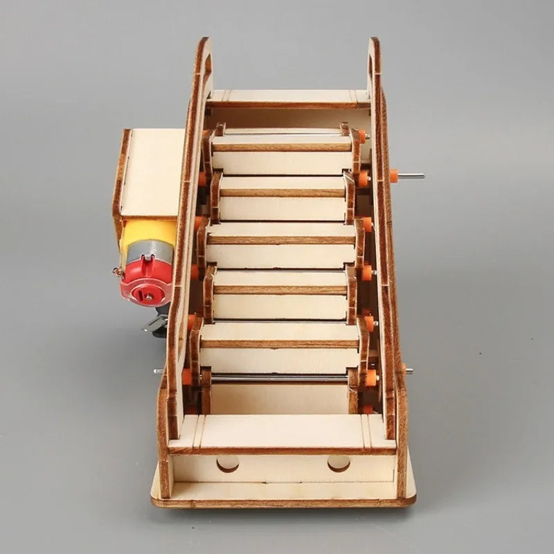 Wooden mechanical model on a gray background