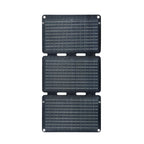 Three black solar panels stacked on a white background