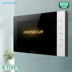 A HOMSECUR indoor video intercom receiver wall mount, model BJT13, featuring a black glossy screen with gold HOMSECUR lettering and a white control panel on the right side, mounted on a textured light gray wall.