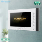 White HOMSECUR W15 video intercom wall panel with a black screen and side buttons, mounted on a textured light blue-gray wall.
