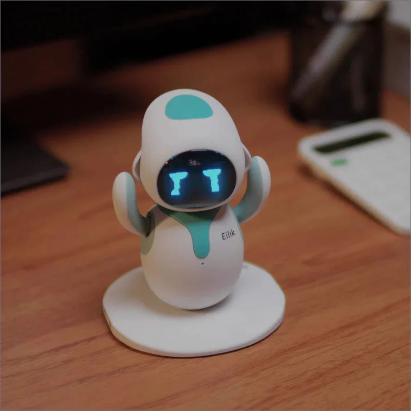 Small robot toy on a wooden surface with a blurred background