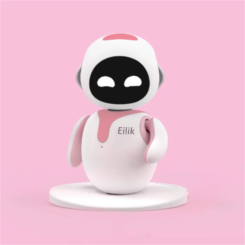 Small robot toy with a pink and white design on a pink background