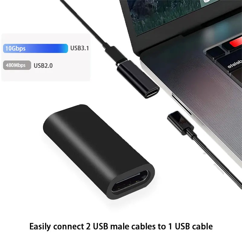 Black USB adapter with cables on a laptop background
