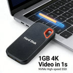 Portable hard disk drive on a laptop keyboard with text highlighting its speed and capacity.