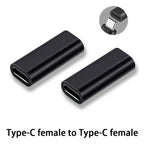 Two black Type-C female to Type-C female adapters on a white background.