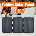 Folding solar panel with '900W' text and person using a laptop in the background