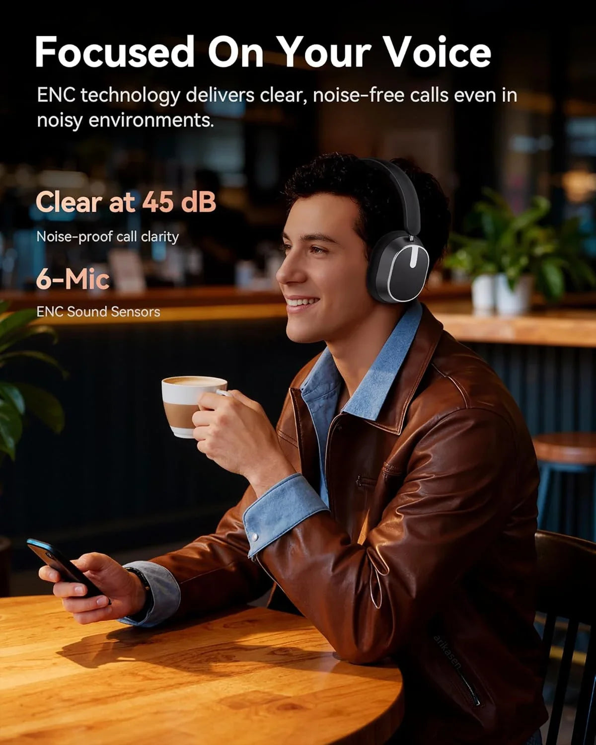 Man wearing headphones and holding a phone, sitting at a table with text about noise-canceling technology.