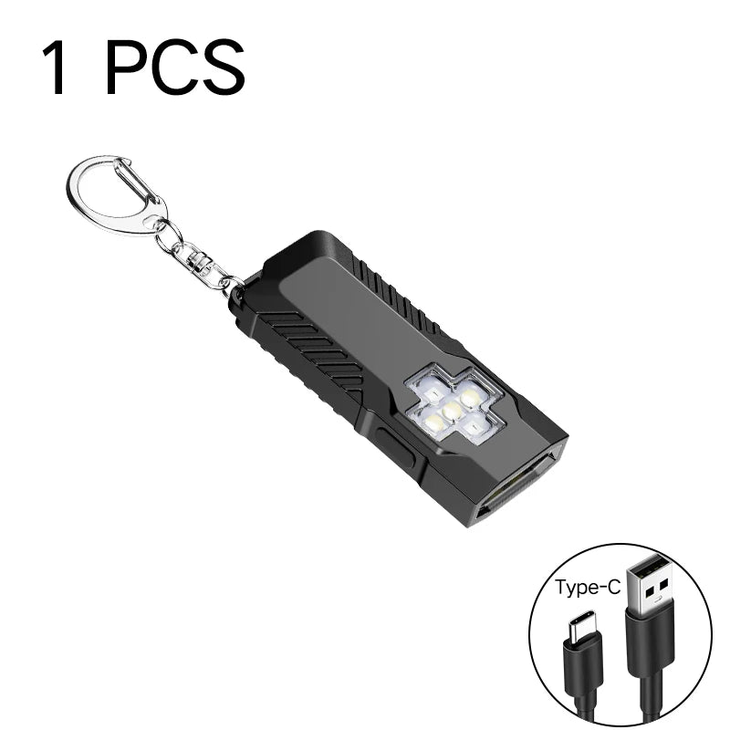 Black flashlight with keychain and Type-C cable on a white background