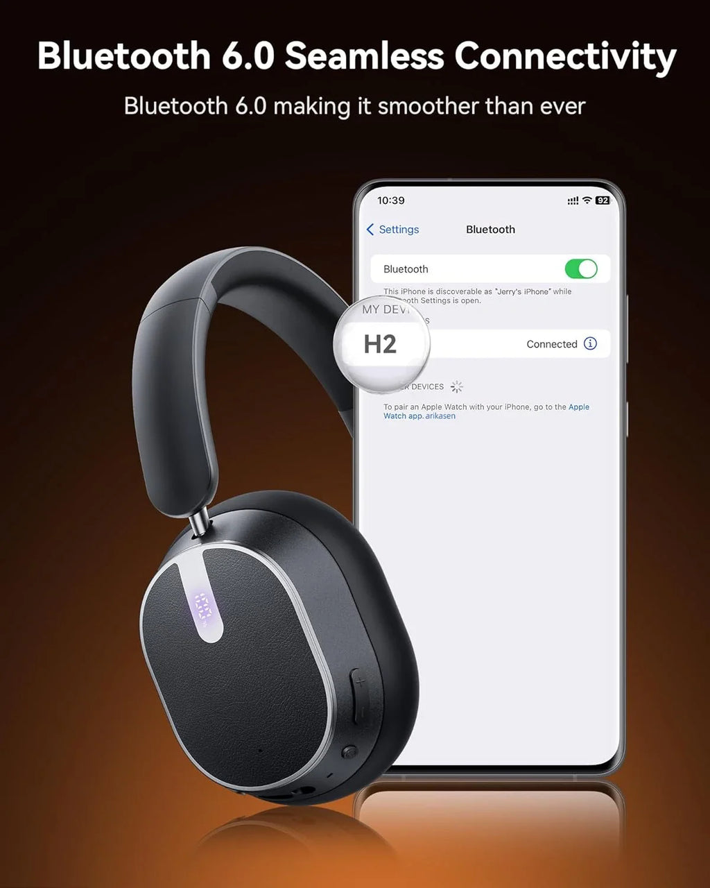 Wireless headphones with smartphone displaying Bluetooth connection on a dark background
