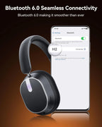 Wireless headphones with smartphone displaying Bluetooth connection on a dark background