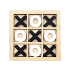 Wooden tic-tac-toe game with black 'X' and white 'O' pieces on a beige background